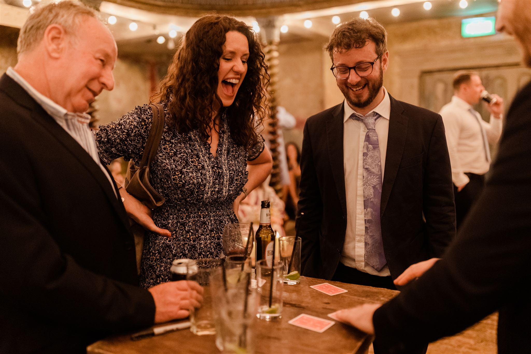 Richard Symes London Magician performing a trick on a cocktail table.