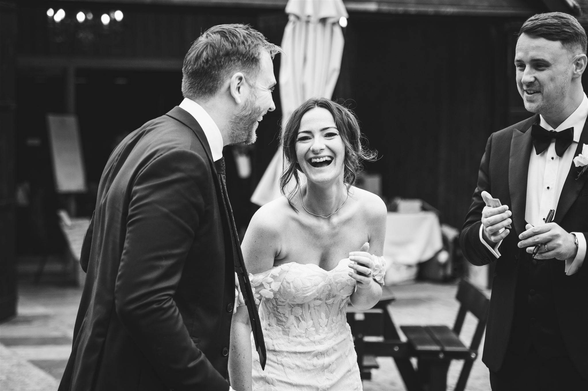 Wedding magician Richard Symes performing close-up magic with the bride and groom, amazing guests with interactive entertainment on their special day