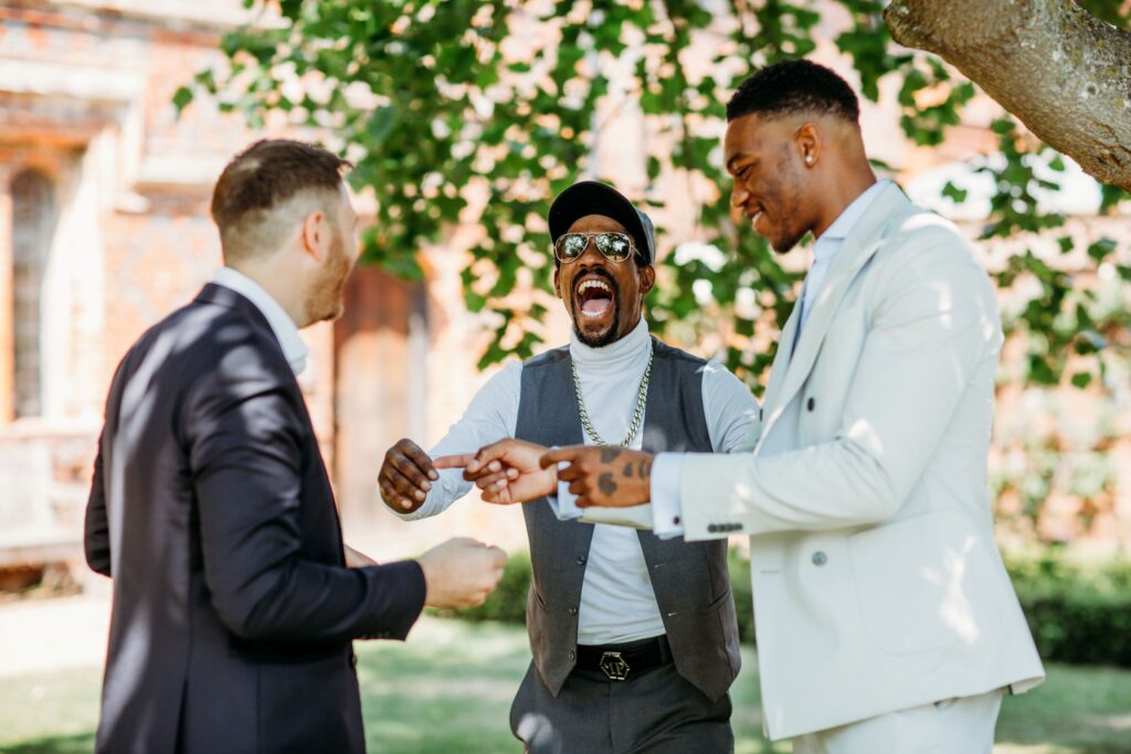 Wedding guests reacting with surprise and laughter during close up magic