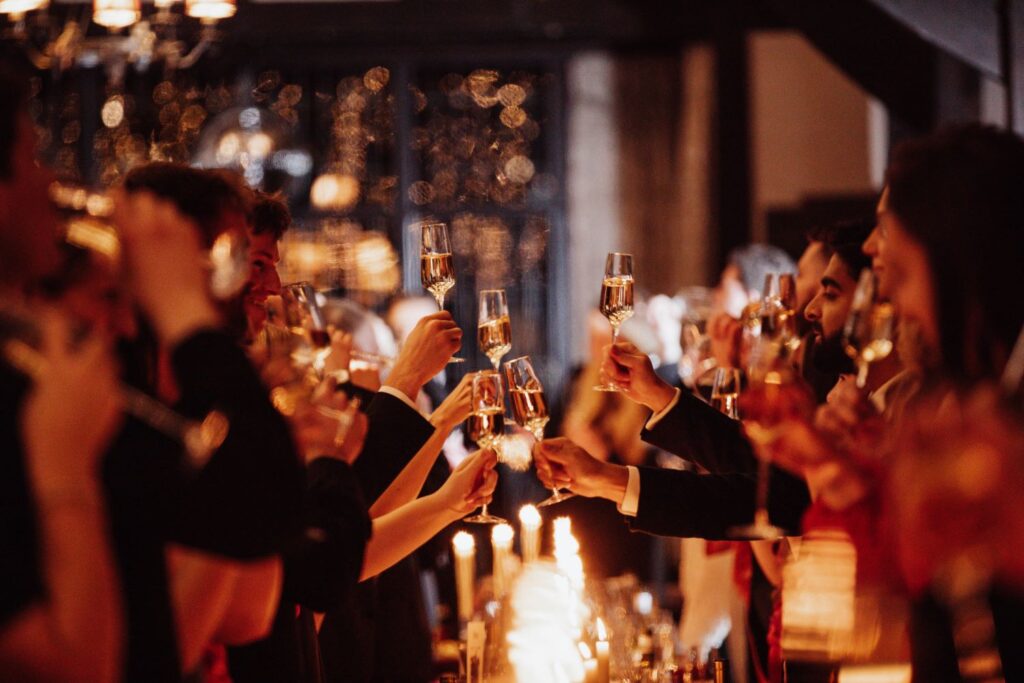Guests raising glasses together at a corporate Christmas party celebration in London