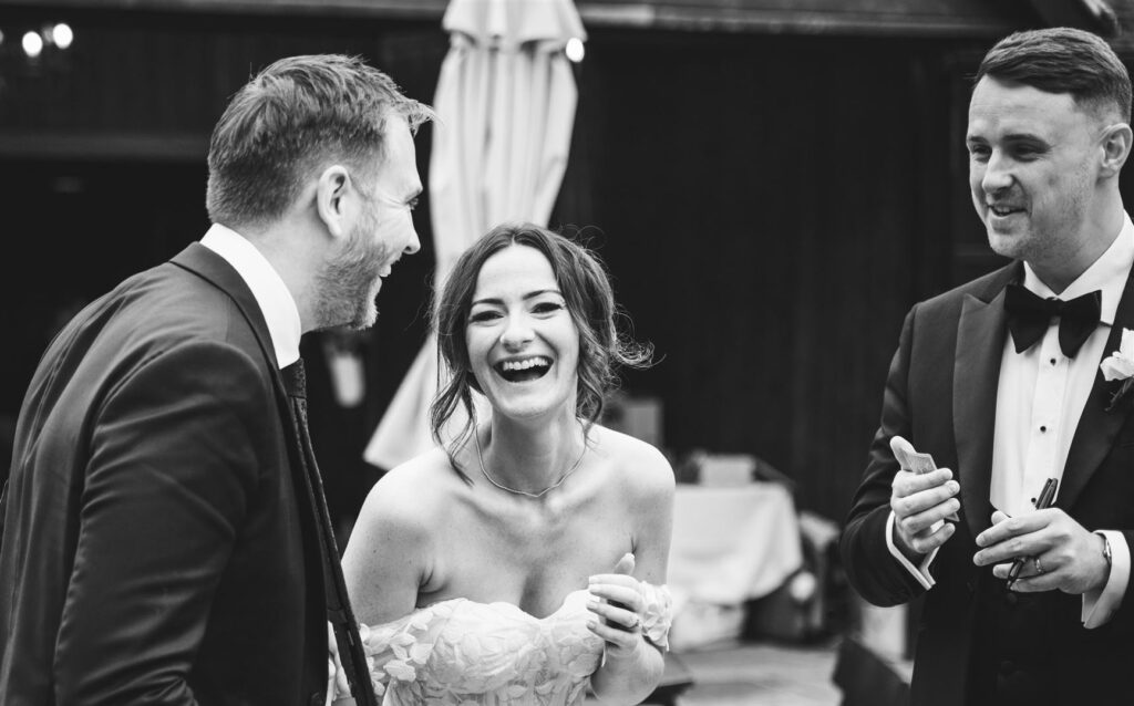 Bride and groom reacting to close up magic at their wedding