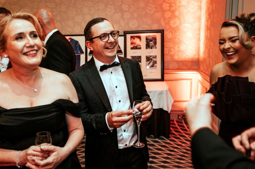 Guests enjoying interactive entertainment at a high end corporate event