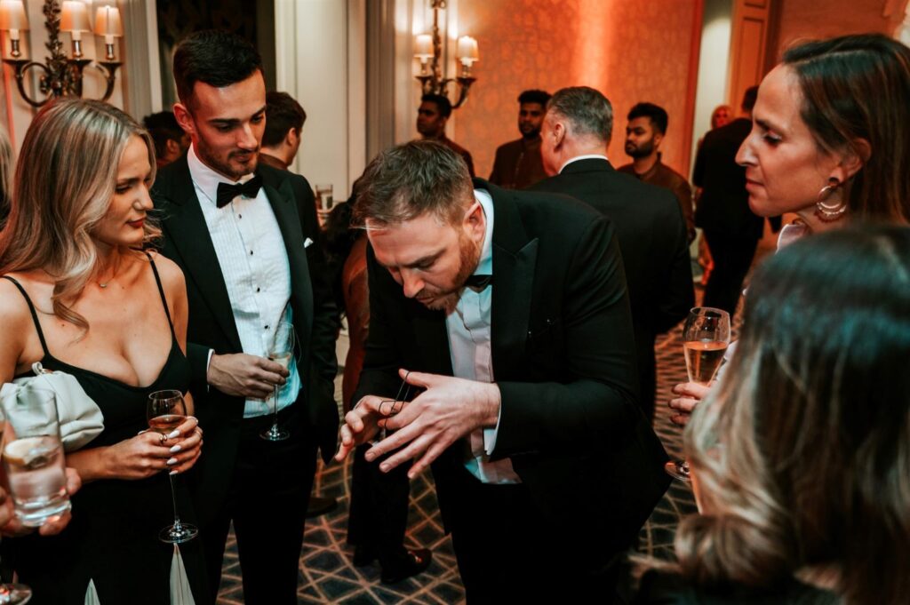 Corporate group watching an illusion as it happens