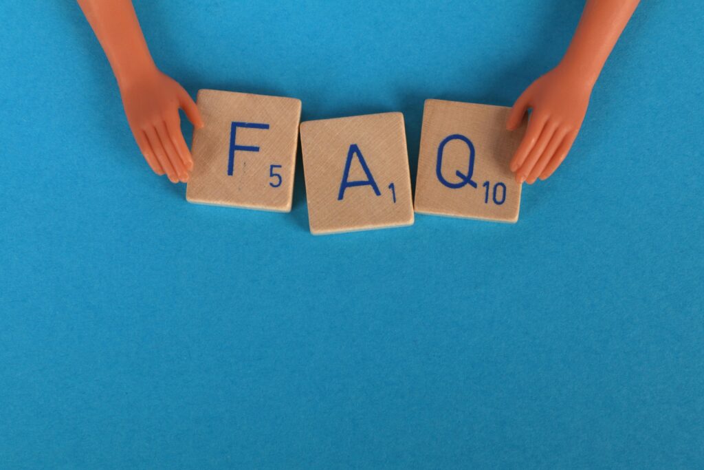 Scrabble squares spelling the word FAQ