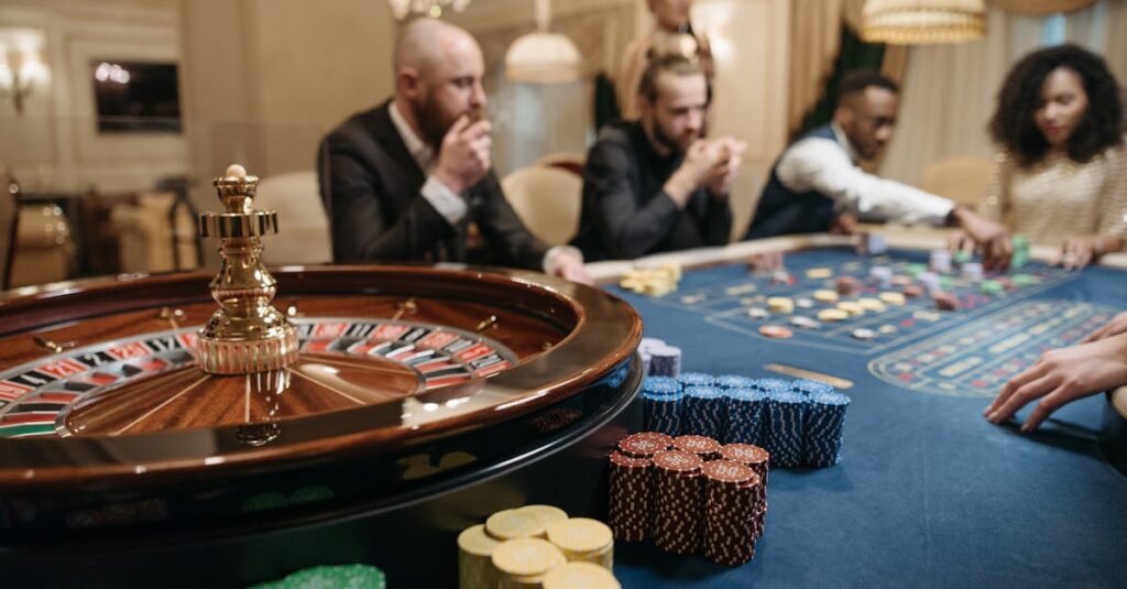 People enjoying a roulette game in an upscale casino setting with chips and a roulette wheel another christmas party entertainment idea.