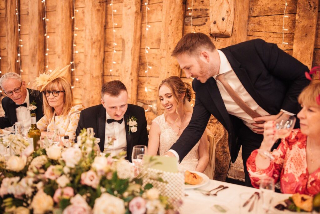 Top table magic performance for bride and groom during wedding breakfast