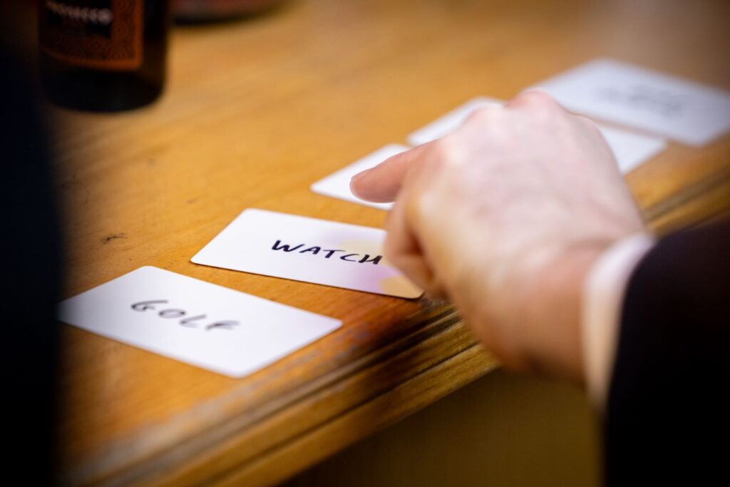 Cards laid out on table with different words on them ready to be picked.