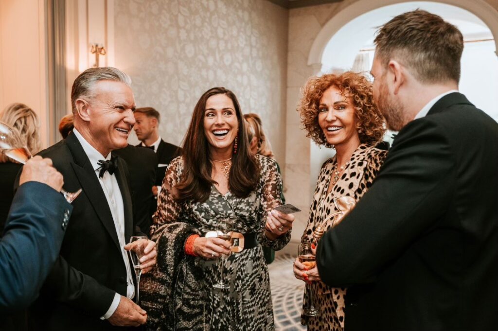 Corporate guests engaged in close-up magic performance