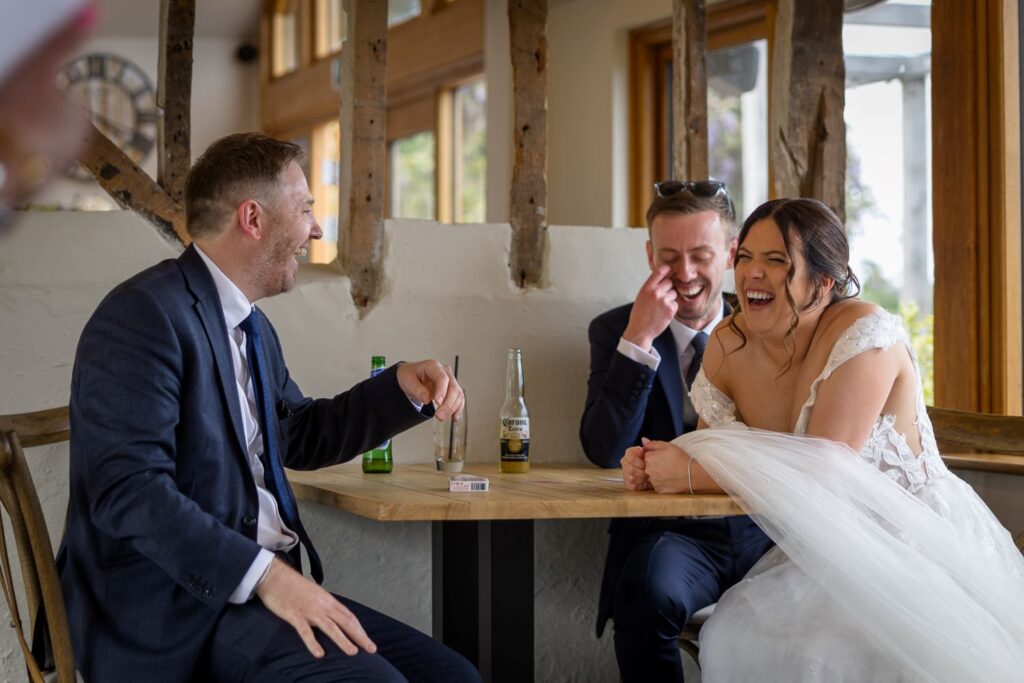 Wedding magician entertaining a wedding couple at the end of a drinks reception in Essex